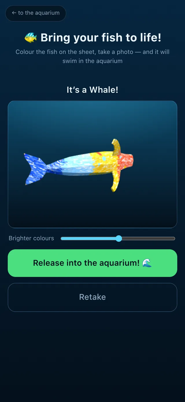 The phone shows the coloured drawing already wrapped onto a 3D fish, with a button to release it